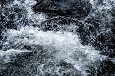 Abstract dark blue Waterfall wave water background textureの写真素材