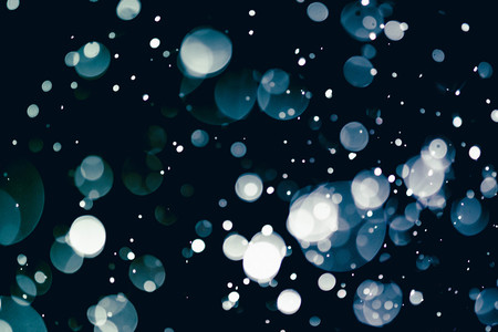 Christmas bokeh background texture abstract light glittering stars on bokeh. glitter vintage lights backgroundの写真素材