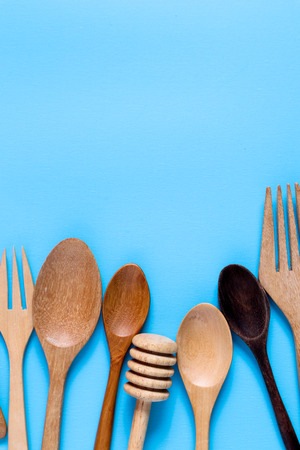 Wooden spoon on blue background, for background menu foodの写真素材