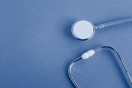 Medical equipments including stethoscope medicines background, top view flat layの写真素材