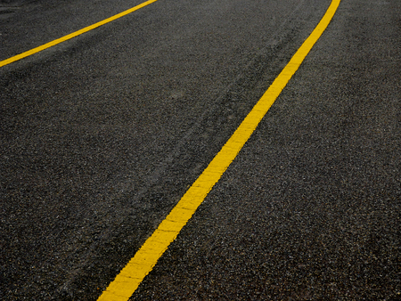 Asphalt surface of road with lines abstract backgroundの写真素材