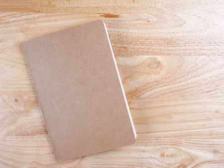 Recycled paper book on wooden backgroundの写真素材