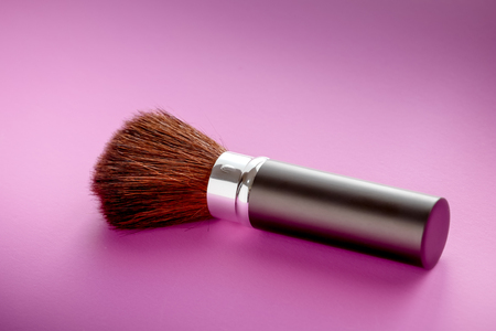 Makeup brush on Pink Pastel paper texture background. Pastel color , Minimal and Valentine concept. Copy spaceの写真素材