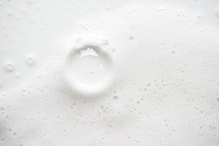 Abstract background white soapy foam texture. Shampoo foam with bubbles
