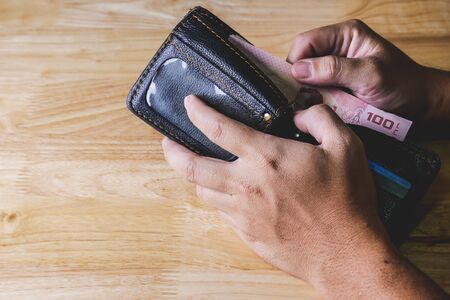 save money for investment concept hand hold a wallet