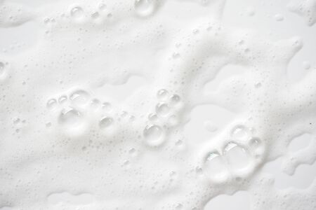 Abstract background white soapy foam texture. Shampoo foam with bubbles