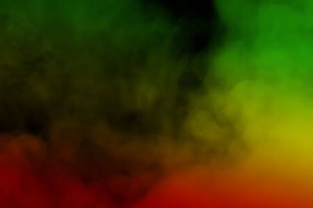abstract background smoke curves and wave reggae colors green, yellow, red colored in flag of reggae musicの写真素材
