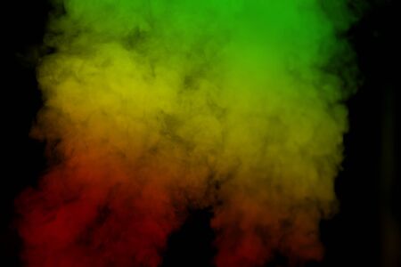 abstract background smoke curves and wave reggae colors green, yellow, red colored in flag of reggae musicの写真素材