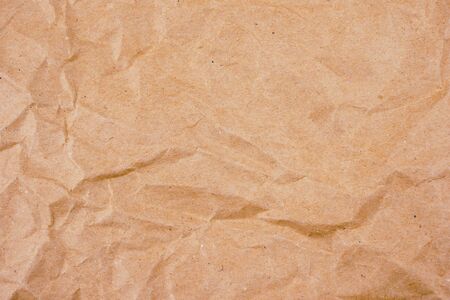 background old brown crumpled paper textureの写真素材