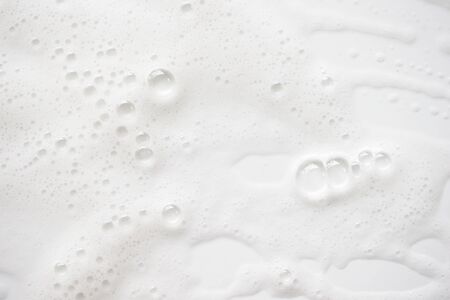 Abstract background white soapy foam texture. Shampoo foam with bubbles