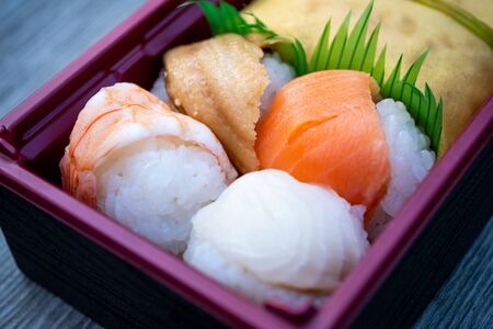 food bento box set ,Japanese food box set which compose of rice, tofu, fish with soy sauce, sushの写真素材