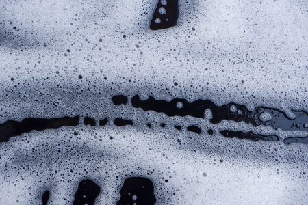 Abstract background white soapy foam texture. Shampoo foam with bubbles