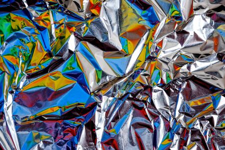 rainbow aluminium foil crumpled Silver texture abstract backgroundの写真素材