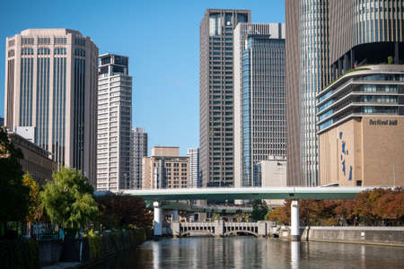 Osaka, Japan - november 10, 2019: Highrise cityscape crowded skyscrapers offices apartments Osaka Japanのeditorial素材
