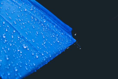 drop on umbrella, background fabric texture of umbrellaの写真素材