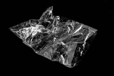 white plastic Bag on black backgroundの写真素材