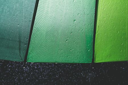  drop rain and umbrella on black backgroundの写真素材