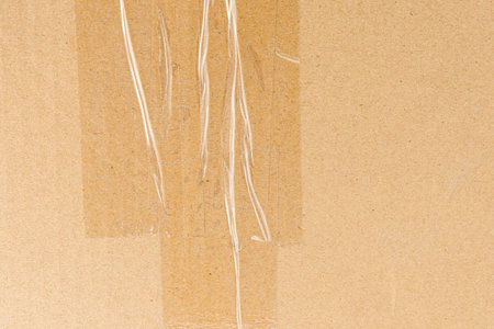 Delivery box closeup with shopping icons and tape, Box paper texture background with tapedの写真素材