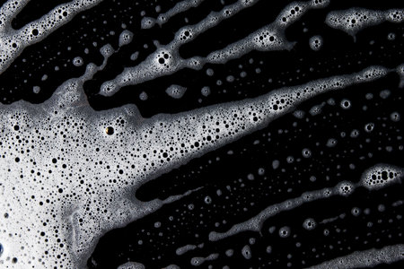 Abstract background white soapy foam texture. Shampoo foam with bubblesの写真素材
