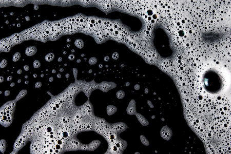 Abstract background white soapy foam texture. Shampoo foam with bubblesの写真素材