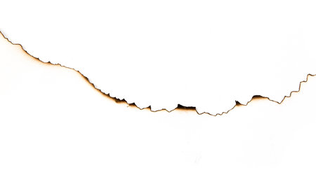 burnt paper on a white backgroundの写真素材