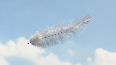 Beautiful Soft and Light White Fluffy Feathers Floating inThe Sky with Cloudsの写真素材