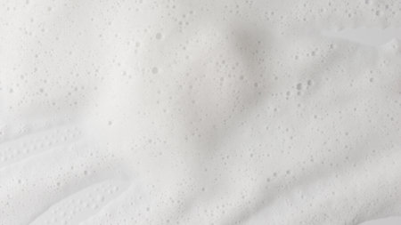 Abstract background white soapy foam texture. Shampoo foam with bubblesの写真素材