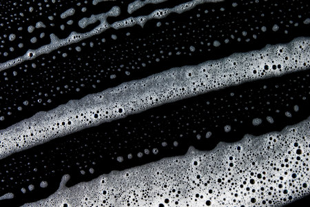 Abstract background white soapy foam texture. Shampoo foam with bubblesの写真素材