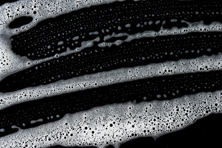 Abstract background white soapy foam texture. Shampoo foam with bubblesの写真素材