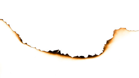 burnt paper on a white backgroundの写真素材