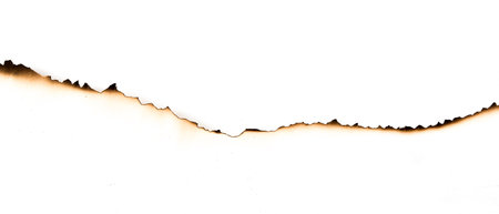 burnt paper on a white backgroundの写真素材