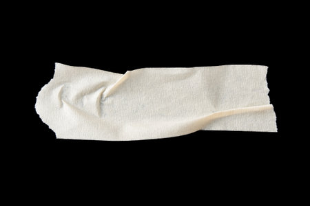 adhesive paper , masking tape isolated on black backgroundの写真素材