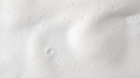 Abstract background white soapy foam texture. Shampoo foam with bubblesの写真素材