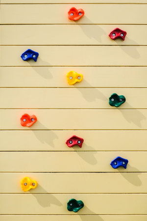 Wooden playground with rock climbing simulator in the parkの写真素材