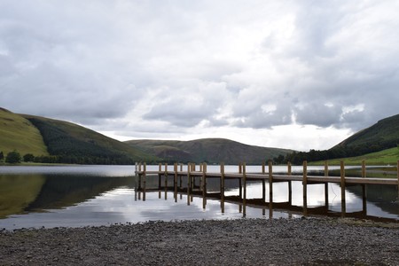 A beautiful little Loch in Scotland near sunsetの写真素材