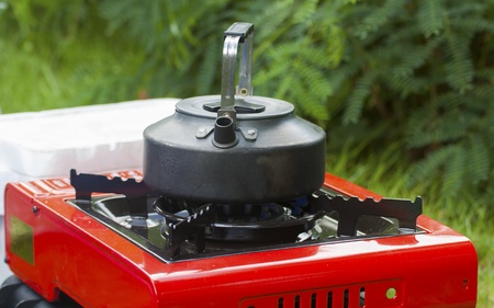 Kettle put on gas stove の写真素材