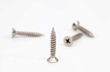 screws group on floor white color の写真素材