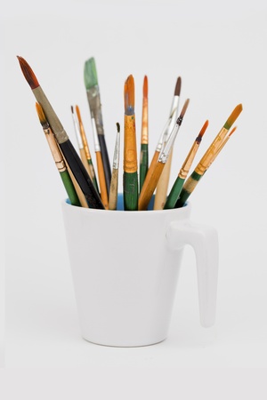 paintbrush old group in water glass の写真素材