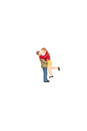 Miniature lover couple ,man holding woman in action glad and happy on white background with clipping path, love couple concept.の写真素材