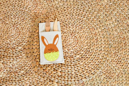 Top view wooden fork and spoon on empty circle nature serving mat isolated on a white background