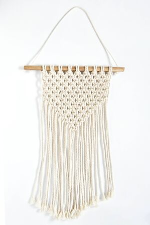 Object, macrame cotton on white background. Decorative handmade hobby interior for hanging on wall . DIY and hobby concept.の写真素材