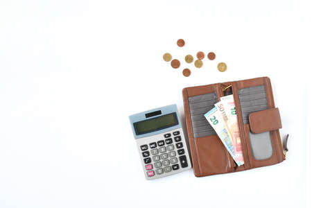 Brow wallet with european banknote coins with calculator on white background. Finance ,income and...