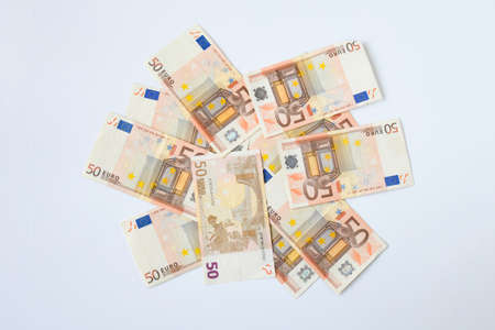 Top view of banknotes of the european union valeur 50 euros a piece on white background. Money and...