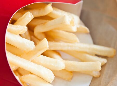 closeup of french fries in red paper box