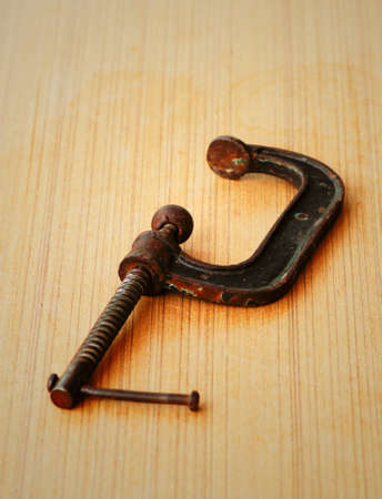 rusty clamp tool in grunge industryの写真素材