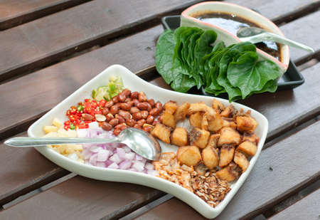 leaf wrapped bite size appetizer with fish, thai foodの写真素材