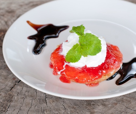 pie with strawberry jam on wooden tableの写真素材