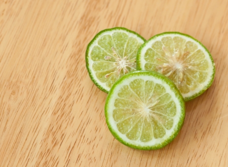 kaffir lime slice on wooden kitchen tableの写真素材