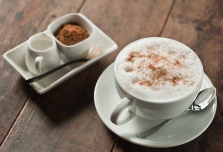 cup of hot coffee on wood tableの写真素材