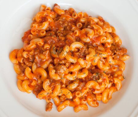 macaroni and cheese with tomato sauce, top viewの写真素材